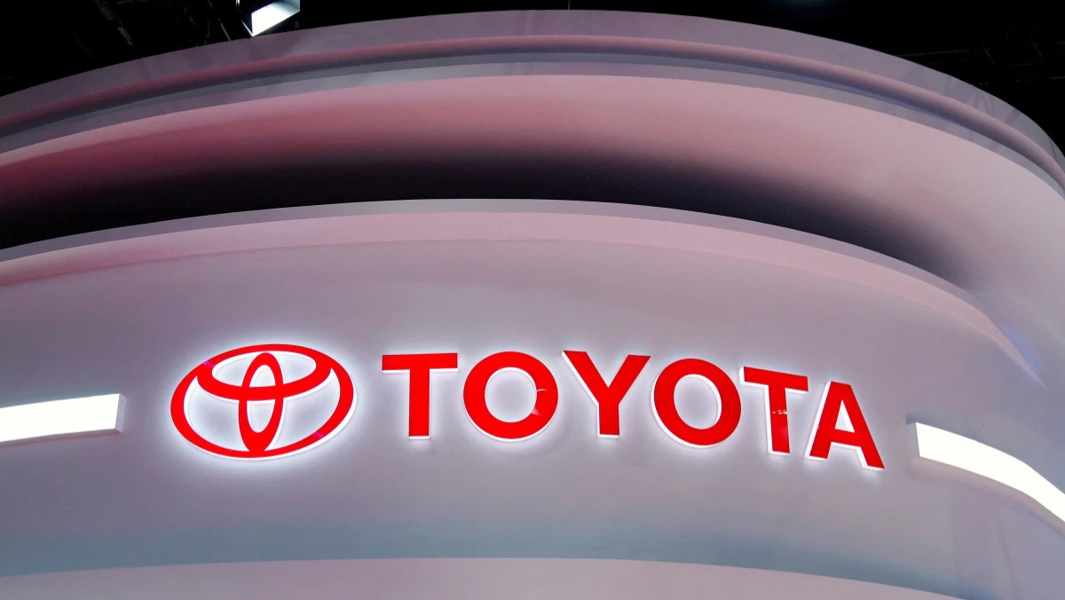 Toyota logo illuminated on a curved display structure at an event