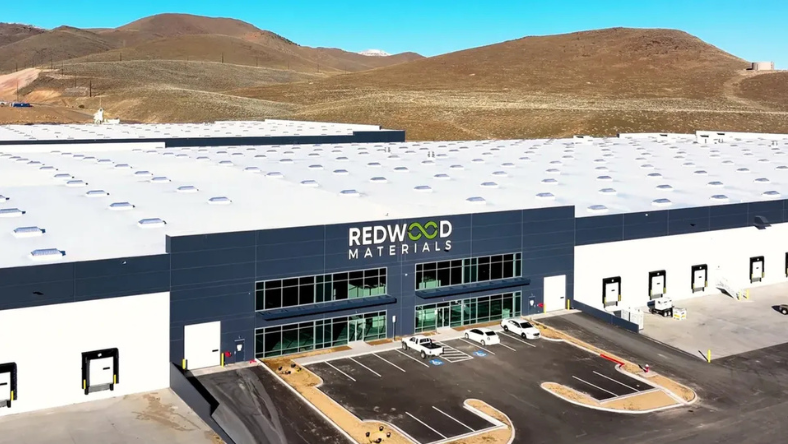 Redwood Materials battery facility exterior with parking and loading bays