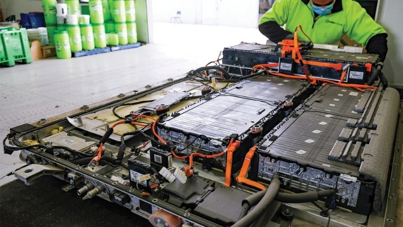 Electric vehicle battery pack undergoing disassembly at a recycling facility