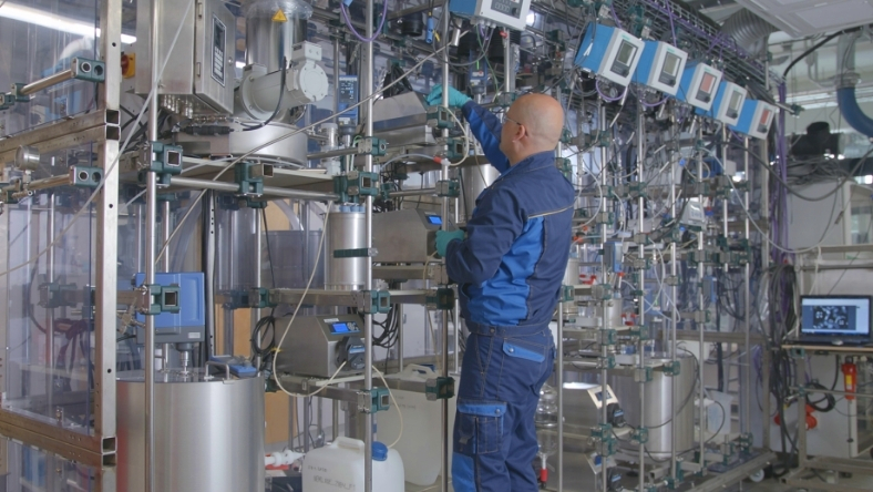 Engineer operating battery recycling pilot plant equipment